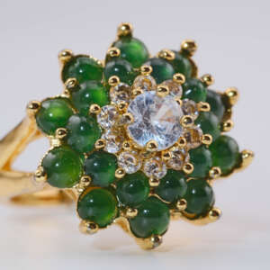 Side angled view of Type-A jadeite ring with 20 green cabochons in gold-tone setting