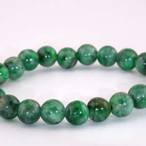 A polished beaded bracelet made of natural Maw Sit Sit jadeite, with approximately 8.5mm round beads showing mottled dark and light green patterns, displayed on a white background.