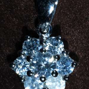 Natural Cambodian white zircon pendant measuring 10.69 x 10.20 x 3.95 mm, set in rhodium-plated 9k white gold, total pendant weight 6.895 carats.